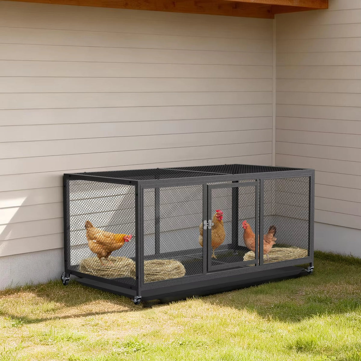 Metal chicken coop with wheels positioned on a grassy lawn next to the side of a house, containing chickens resting on nesting material.