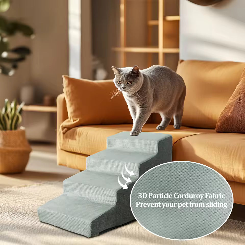 Cat walking up a grey 4-step pet stair made of 3D particle corduroy fabric next to a sofa.