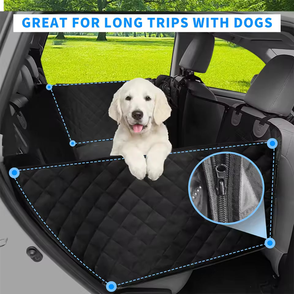 A white puppy rests in a black car seat cover with a zippered side mesh panel.